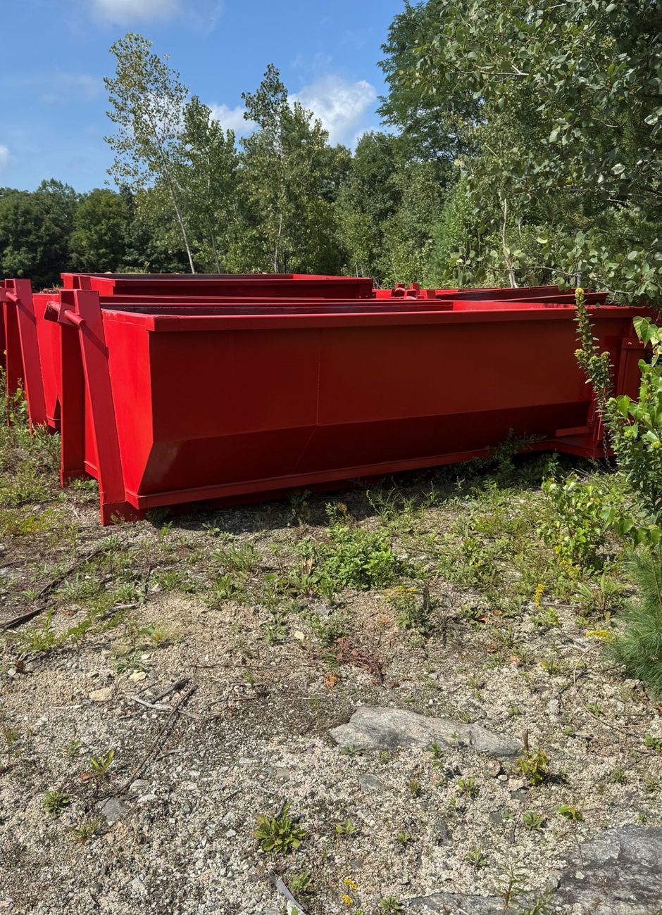 Dumpster Dawgs fleet of red roll-off dumpsters